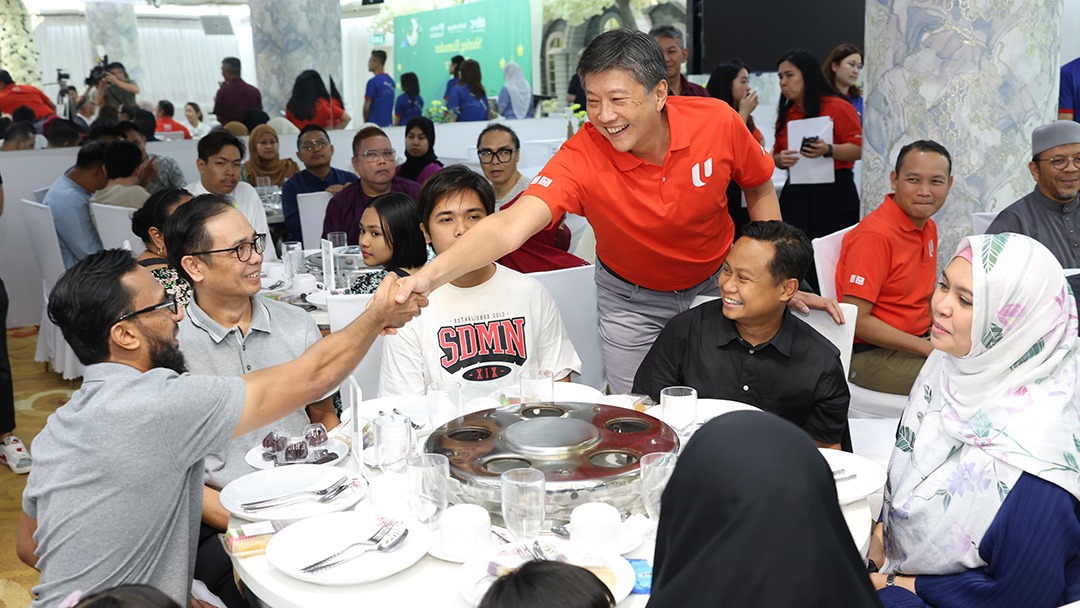 NTUC SG Ng Chee Meng greeting beneficiaries